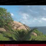 Land on the ocean. With huge rocks.