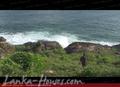 Land on the ocean. With huge rocks.