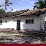 Beach land with old house.