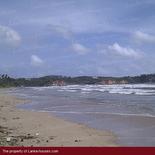 Beach land with old house.