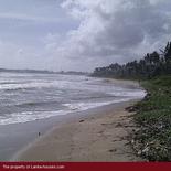 Beach land with old house.